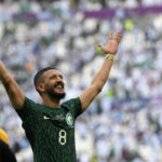 
              FILE - Saudi Arabia's Abdulelha Al-Malki celebrates at the end of the World Cup group C soccer match between Argentina and Saudi Arabia at the Lusail Stadium in Lusail, Qatar, on Nov. 22, 2022. Saudi Arabia won 2-1. For a brief moment after Saudi Arabia's Salem Aldawsari fired a soccer ball from just inside the penalty box into the back of the net to seal a win against Argentina, Arabs across the divided Middle East found something to celebrate. (AP Photo/Ricardo Mazalan, File)
            