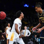 
              Michigan's Jett Howard (13) reacts after Arizona State's Desmond Cambridge Jr. dunked the ball during the second half of an NCAA college basketball game in the championship round of the Legends Classic Thursday, Nov. 17, 2022, in New York. Arizona State won 87-62. (AP Photo/Frank Franklin II)
            