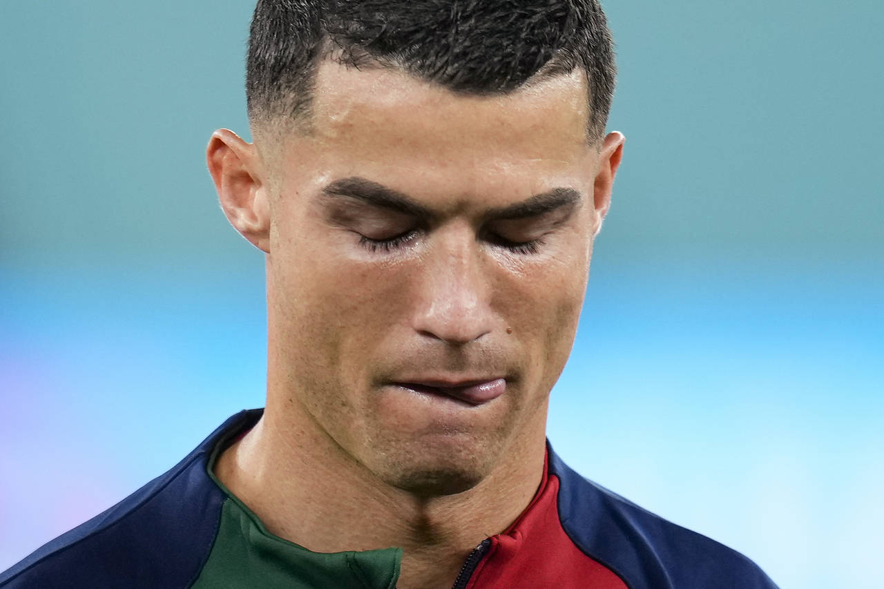 Portugal's Cristiano Ronaldo reacts while listening to the Portugal's national anthem prior the sta...