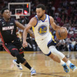 
              Golden State Warriors guard Stephen Curry (30) drives to the basket past Miami Heat guard Kyle Lowry (7) during the first half of an NBA basketball game, Tuesday, Nov. 1, 2022, in Miami. (AP Photo/Wilfredo Lee)
            