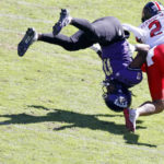
              TCU wide receiver Blair Conwright (0) is upended by Texas Tech defensive back Reggie Pearson Jr. (2) on an incomplete pass during the second half of an NCAA college football game Saturday, Nov. 5, 2022, in Fort Worth, Texas. (AP Photo/Ron Jenkins)
            