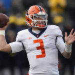 
              Illinois quarterback Tommy DeVito (3) throws against Michigan in the second half of an NCAA college football game in Ann Arbor, Mich., Saturday, Nov. 19, 2022. (AP Photo/Paul Sancya)
            