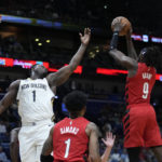 
              New Orleans Pelicans forward Zion Williamson (1) reaches for a rebound held by Portland Trail Blazers forward Jerami Grant (9) during the first half of an NBA basketball game in New Orleans, Thursday, Nov. 10, 2022. (AP Photo/Gerald Herbert)
            