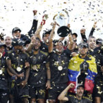 
              Los Angeles FC's Carlos Vela hoists the trophy alongside teammates after defeating the Philadelphia Union in a penalty kick shootout to win the MLS Cup soccer match Saturday, Nov. 5, 2022, in Los Angeles. (AP Photo/Marcio Jose Sanchez)
            