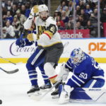
              Toronto Maple Leafs goaltender Erik Kallgren (50) makes a save as Vegas Golden Knights forward Mark Stone (61) looks for the rebound during the first period of an NHL hockey game, Tuesday, Nov. 8, 2022 in Toronto. (Nathan Denette/The Canadian Press via AP)
            