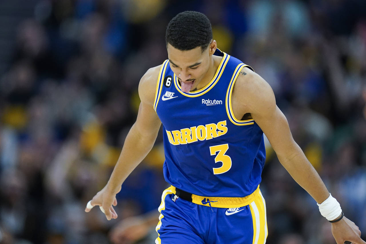 Golden State Warriors guard Jordan Poole reacts after scoring against the San Antonio Spurs during ...