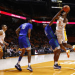 
              Tennessee forward Julian Phillips (2) shoots as he's fouled by Florida Gulf Coast guard Franco Miller Jr. (12) during the first half of an NCAA college basketball game Wednesday, Nov. 16, 2022, in Knoxville, Tenn. (AP Photo/Wade Payne)
            