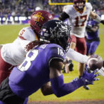 
              TCU wide receiver Savion Williams (18) catches a touchdown catch against Iowa State defensive back Myles Purchase (5) during the second half of an NCAA college football game in Fort Worth, Texas, Saturday, Nov. 26, 2022. TCU won 62-14. (AP Photo/LM Otero)
            