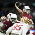 
              Arizona Cardinals quarterback Colt McCoy throws a pass during the first half of an NFL football game against the San Francisco 49ers, Monday, Nov. 21, 2022, in Mexico City. (AP Photo/Marcio Jose Sanchez)
            