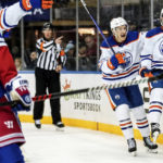 
              Edmonton Oilers center Ryan McLeod (71) and left wing Dylan Holloway (55) celebrate after Holloway scored a goal and tied the score during the third period of an NHL hockey game against the New York Rangers, Saturday, Nov. 26, 2022, in New York. (AP Photo/Julia Nikhinson)
            