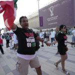 
              Protesters wear t-shirts reading "Rise with the women of Iran" outside the Ahmad Bin Ali Stadium at the end of the World Cup group B soccer match between Wales and Iran, in Al Rayyan, Qatar, Friday, Nov. 25, 2022. (AP Photo/Alessandra Tarantino)
            