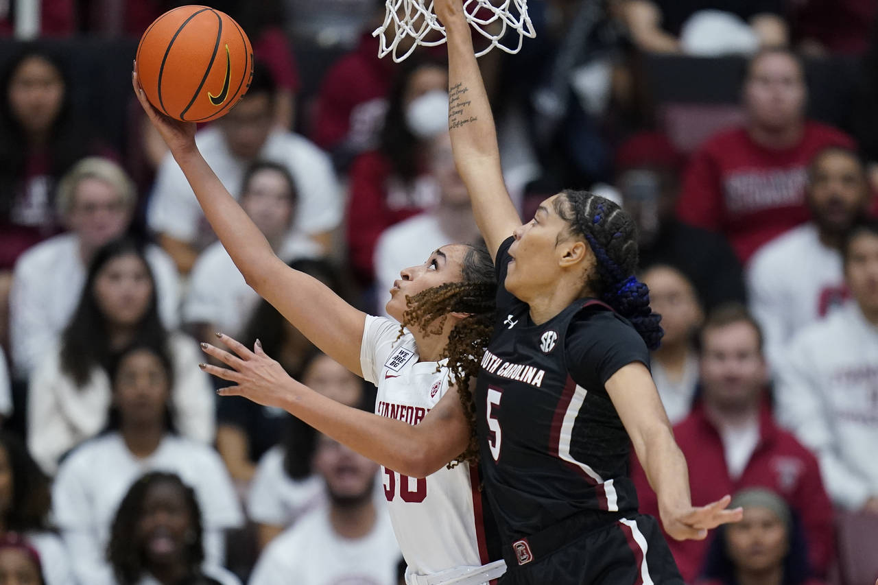 Stanford guard Haley Jones shoots the ball while defended by South Carolina forward Victaria Saxton...