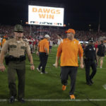 
              Tennessee head coach Josh Heupel walks off the field after losing to Georgia in an NCAA college football game Saturday, Nov. 5, 2022 in Athens, Ga. (AP Photo/John Bazemore)
            