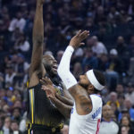 
              Golden State Warriors forward Draymond Green, left, shoots against Los Angeles Clippers forward Marcus Morris Sr. during the first half of an NBA basketball game in San Francisco, Wednesday, Nov. 23, 2022. (AP Photo/Jeff Chiu)
            