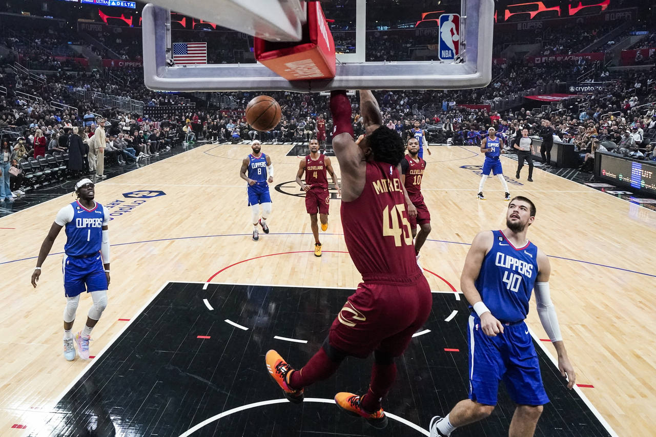 Cleveland Cavaliers guard Donovan Mitchell (45) dunks the ball during the first half of an NBA bask...