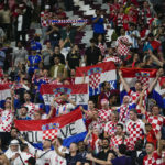 
              Croatia's soccer team fans celebrate their 4-1 victory over Canada during the World Cup group F soccer at the Khalifa International Stadium in Doha, Qatar, Sunday, Nov. 27, 2022. (AP Photo/Darko Vojinovic)
            