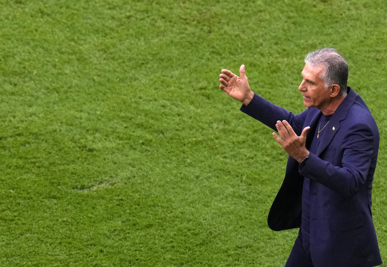 Iran's head coach Carlos Queiroz reacts during the World Cup group B soccer match between Wales and...