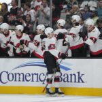 
              Ottawa Senators left wing Tim Stützle (18) celebrates with teammates after scoring a goal against the San Jose Sharks during the first period of an NHL hockey game in San Jose, Calif., Monday, Nov. 21, 2022. (AP Photo/Godofredo A. Vásquez)
            