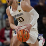 
              West Virginia guard Erik Stevenson (10) reacts to a call during the second half of the team's NCAA college basketball game against Purdue in the Phil Knight Legacy tournament Thursday, Nov. 24, 2022, in Portland, Ore. (AP Photo/Rick Bowmer)
            