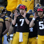 
              Iowa quarterback Spencer Petras (7) signals a play during the first half of an NCAA college football game against Nebraska, Friday, Nov. 25, 2022, in Iowa City, Iowa. (AP Photo/Charlie Neibergall)
            