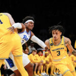 
              Michigan's Jaelin Llewellyn (3) uses a pick set by Hunter Dickinson (1) to drives past Pittsburgh's Blake Hinson (2) during the first half of an NCAA basketball game at the Legends Classic Wednesday, Nov. 16, 2022, in New York. (AP Photo/Frank Franklin II)
            