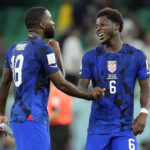 
              United States' Shaq Moore (18) and Yunus Musah celebrate after defeating Iran in the World Cup group B soccer match between Iran and the United States at the Al Thumama Stadium in Doha, Qatar, Tuesday, Nov. 29, 2022. (AP Photo/Ashley Landis)
            
