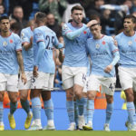 
              Manchester City's Phil Foden, second from right, celebrates with his teammates after scoring his side's first goal during the English Premier League soccer match between Manchester City and Brentford, at the Etihad stadium in Manchester, England, Saturday, Nov.12, 2022. (AP Photo/Dave Thompson)
            