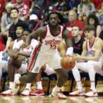 
              Ohio State guard Isaac Likekele (13) drives down the court against Texas Tech during the second half of an NCAA college basketball game, Wednesday, Nov. 23, 2022, in Lahaina, Hawaii. (AP Photo/Marco Garcia)
            