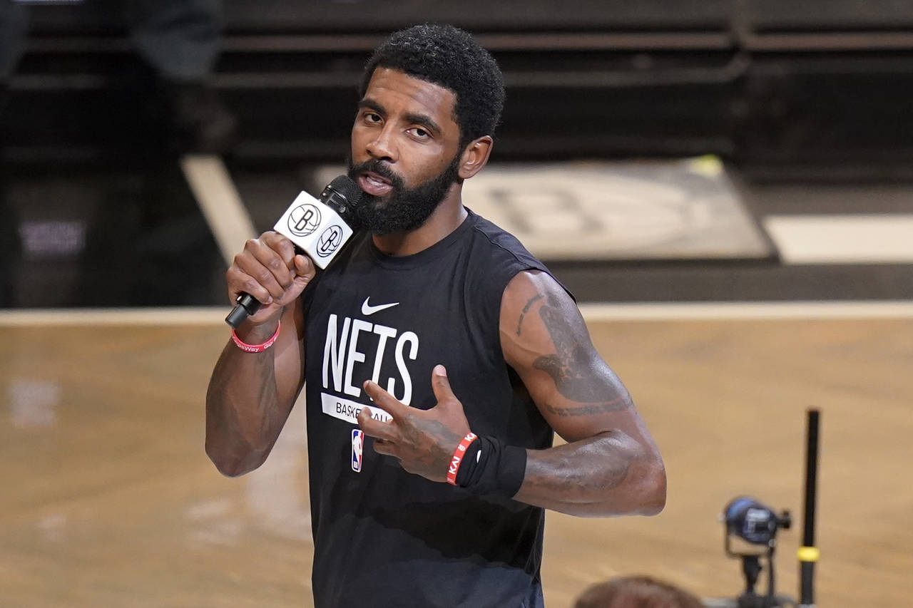 FILE - Brooklyn Nets' Kyrie Irving speaks before the team's NBA basketball game against the New Orl...