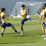 
              Players warm up during a training session of Japan national team in Doha, Qatar, Friday, Nov. 25, 2022. (AP Photo/Eugene Hoshiko)
            