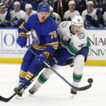 
              Buffalo Sabres defenseman Jacob Bryson (78) and Vancouver Canucks center Nils Aman (88) battle for the puck during the first period of an NHL hockey game, Tuesday, Nov. 15, 2022, in Buffalo, N.Y. (AP Photo/Jeffrey T. Barnes)
            