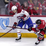 
              Montreal Canadiens defenseman Johnathan Kovacevic, left, looks to pass against Chicago Blackhawks center Jonathan Toews during the second period of an NHL hockey game in Chicago, Friday, Nov. 25, 2022. (AP Photo/Nam Y. Huh)
            