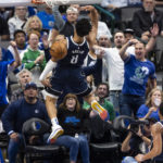 
              Dallas Mavericks guard Josh Green (8) dunks during the first half of the team's NBA basketball game against the Toronto Raptors, Friday, Nov. 4, 2022, in Dallas. (AP Photo/Brandon Wade)
            