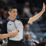 
              Referee Hwang Intae signals in the first half of an NBA preseason basketball game between the Charlotte Hornets and the Washington Wizards in Charlotte, N.C., Monday, Oct. 10, 2022. (AP Photo/Jacob Kupferman)
            