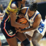 
              Connecticut forward Aaliyah Edwards, left, and Duke guard Jordyn Oliver, right, battle for the ball during the first half of an NCAA college basketball game in the Phil Knight Legacy tournament Friday, Nov. 25, 2022, in Portland, Ore. (AP Photo/Rick Bowmer)
            