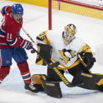 
              Montreal Canadiens' Brendan Gallagher (11) moves in against Pittsburgh Penguins goaltender Tristan Jarry (35) during second-period NHL hockey game action in Montreal, Saturday, Nov. 12, 2022. (Graham Hughes/The Canadian Press via AP)
            