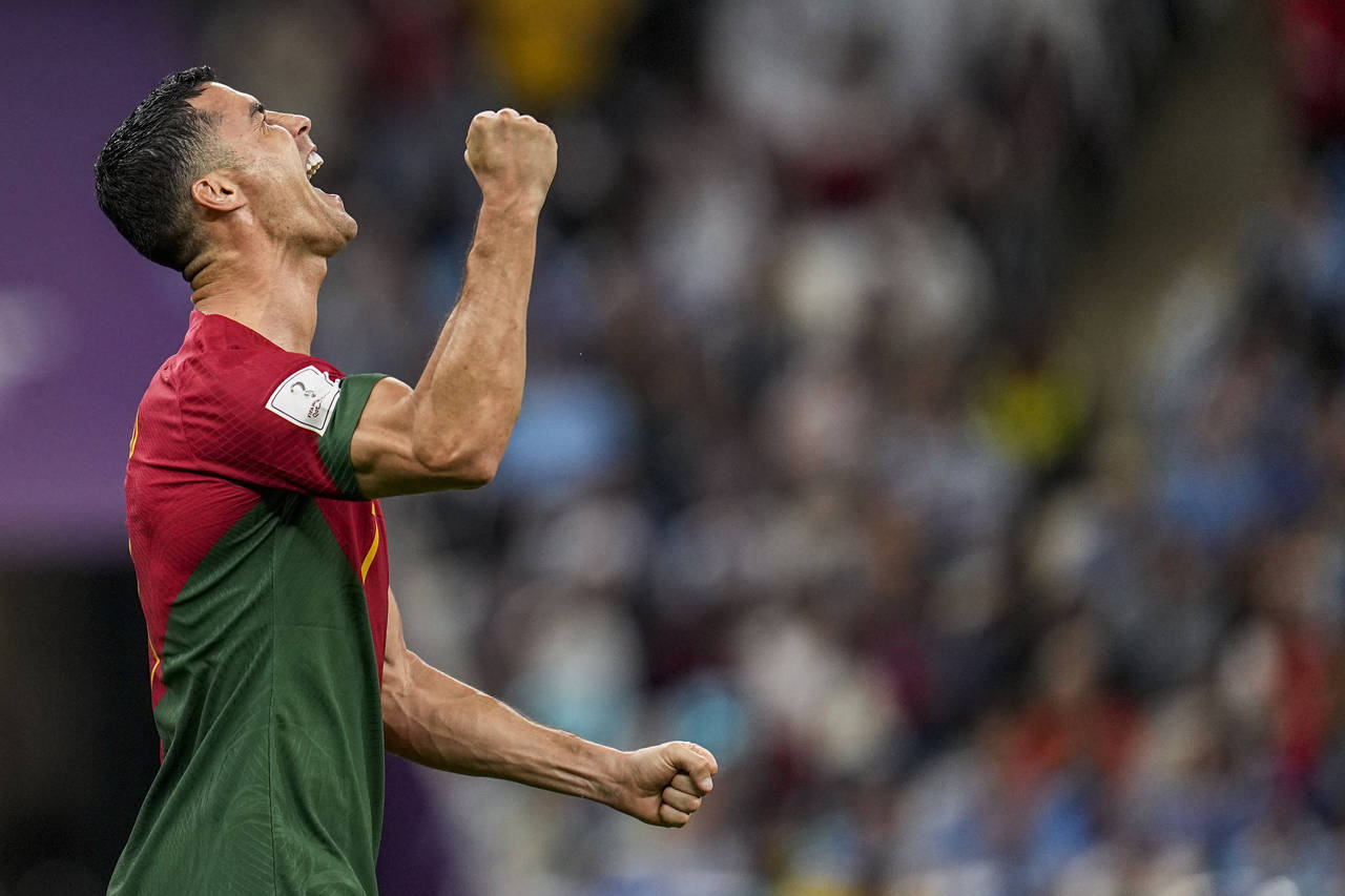 Portugal's Cristiano Ronaldo celebrates after scoring his side's opening goal during the World Cup ...