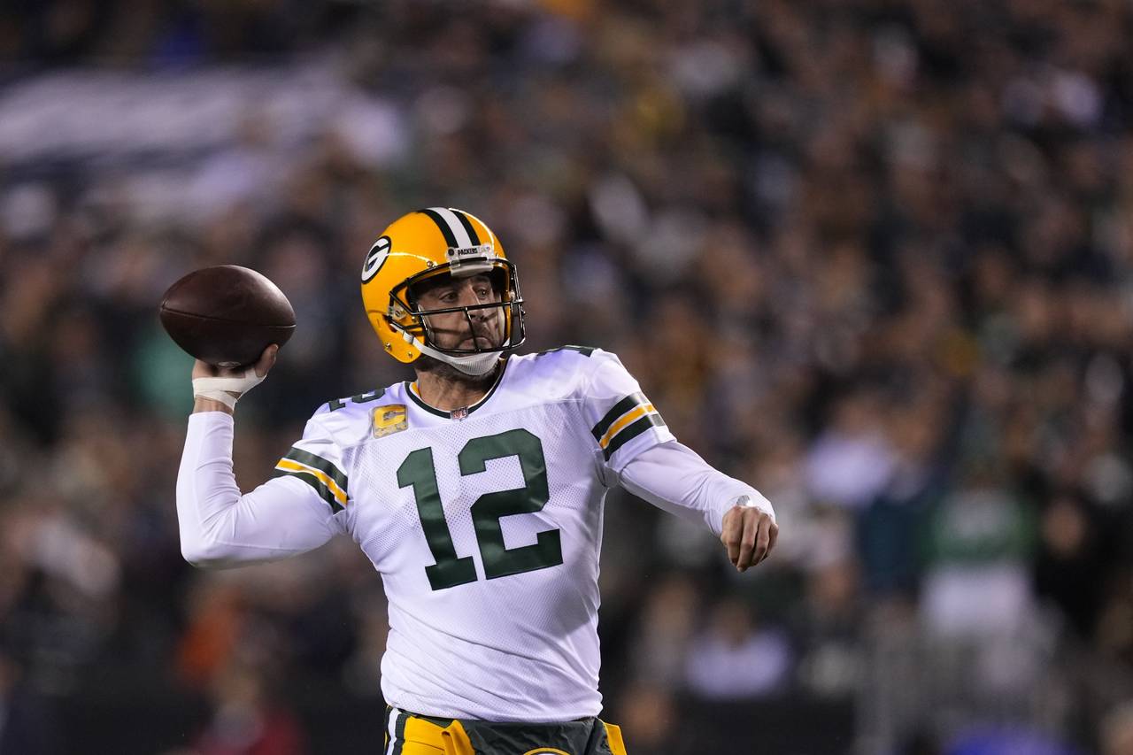 Green Bay Packers quarterback Aaron Rodgers throws during the first half of an NFL football game ag...