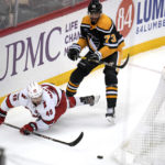 
              Pittsburgh Penguins' Pierre-Olivier Joseph (73) collides with Carolina Hurricanes' Jordan Martinook during the first period of an NHL hockey game in Pittsburgh, Tuesday, Nov. 29, 2022. (AP Photo/Gene J. Puskar)
            