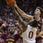 
              Bethune-Cookman center Elijah Hulsewe, right, blocks a shot by Indiana guard Xavier Johnson (0) during the second half of an NCAA college basketball game, Thursday, Nov. 10, 2022, in Bloomington, Ind. (AP Photo/Doug McSchooler)
            