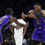 
              Los Angeles Lakers guard Russell Westbrook (0) and guard Patrick Beverley (21) celebrate after Westbrook scored during the first half of the team's NBA basketball game against the Utah Jazz on Friday, Nov. 4, 2022, in Los Angeles. (AP Photo/Marcio Jose Sanchez)
            