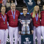 
              Tennis legend Billie Jean King poses with the Switzerland players Simona Waltert, Viktorija Golubic, Jil Teichmann and Belinda Bencic and Switzerland team captain Heinz Guenthardt,after they defeated Australia to win the Billie Jean King Cup tennis finals, at the Emirates Arena in Glasgow, Scotland, Sunday, Nov. 13, 2022. (AP Photo/Kin Cheung)
            
