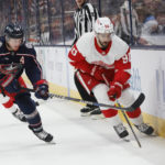 
              Detroit Red Wings' Joe Veleno, right, carries the puck up ice as Columbus Blue Jackets' Gustav Nyquist defends during the first period of an NHL hockey game, Saturday, Nov. 19, 2022, in Columbus, Ohio. (AP Photo/Jay LaPrete)
            