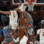 
              Houston Christian forward Jason Thompson, top right, is fouled by Texas forward Dillon Mitchell (23) as he drives to the basket during the second half of an NCAA college basketball game, Thursday, Nov. 10, 2022, in Austin, Texas. (AP Photo/Eric Gay)
            