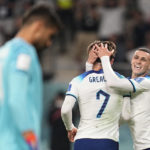
              England's Jack Grealish, center, celebrates with teammate Phil Foden, right, after scoring his side's sixth goal during the World Cup group B soccer match between England and Iran at the Khalifa International Stadium in Doha, Qatar, Monday, Nov. 21, 2022. (AP Photo/Abbie Parr)
            