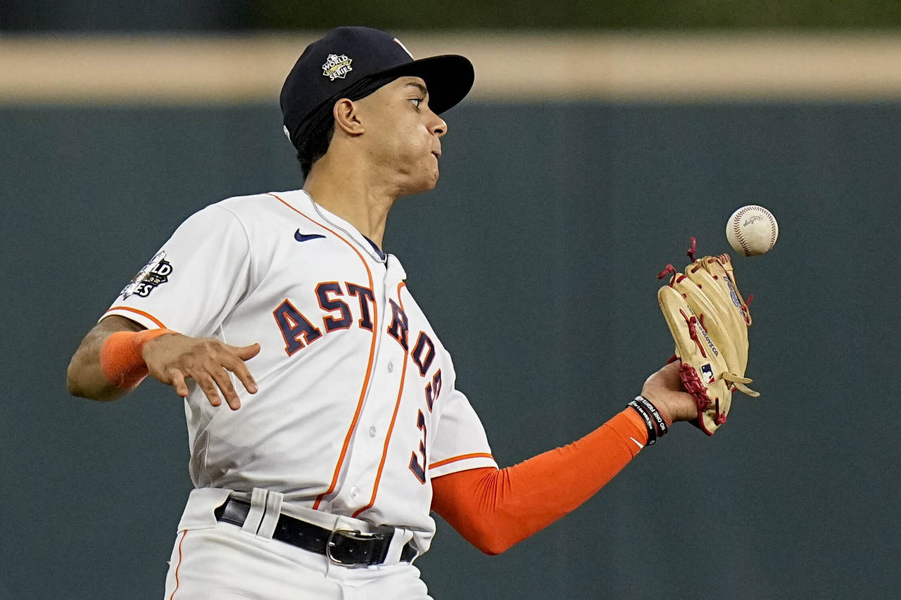 Houston Astros shortstop Jeremy Pena catches a fly ball hit by Philadelphia Phillies' Rhys Hoskins ...