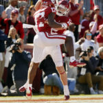 
              Oklahoma wide receiver Marvin Mims (17) and wide receiver Drake Stoops (12) celebrate a touchdown by Mims against Baylor in the first half of an NCAA college football game, Saturday, Nov. 5, 2022, in Norman, Okla. (AP Photo/Nate Billings)
            