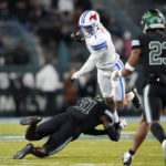 
              Southern Methodist wide receiver Jordan Kerley (1) is tackled by Southern Methodist cornerback Ford Parker (31) during the first half of an NCAA college football game in New Orleans, Thursday, Nov. 17, 2022. (AP Photo/Gerald Herbert)
            