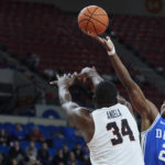 
              Duke guard Jaylen Blakes, right, shoots over Oregon State forward Rodrigue Andela, left, during the first half of an NCAA college basketball game in the Phil Knight Legacy tournament in Portland, Ore., Thursday, Nov. 24, 2022. (AP Photo/Craig Mitchelldyer)
            