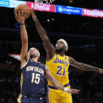 
              New Orleans Pelicans guard Jose Alvarado, left, shoots as Los Angeles Lakers guard Patrick Beverley defends during the first half of an NBA basketball game Wednesday, Nov. 2, 2022, in Los Angeles. (AP Photo/Mark J. Terrill)
            